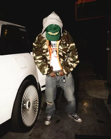 Alpha Industries Camo Hooded Bomber Jacket worn by Wiz Khalifa on the Instagram account @wizkhalifa