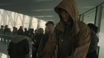 Mickey 17 Movie Outfits: Mickey Barnes (Robert Pattinson) is wearing Brown Rain Hoodie Jacket
