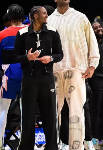 Amiri Black & Cream 'MA Band' Bomber Jacket worn by Tyrese Maxey on the Instagram account @nbafashionfits