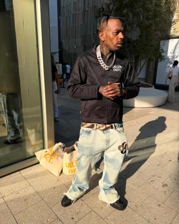 Gallery Dept. Light Blue & Multicolor G-Patch Flared Jeans worn by Sauce Walka on the Instagram account @sauce_walkatsf