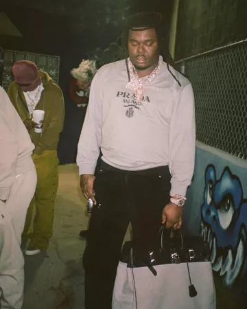 Sac Hermès en toile grise 'HAC Birkin 40' porté par Lucki sur le compte Instagram @deadboylife