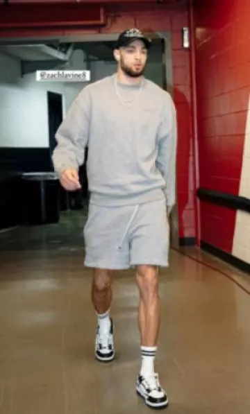 Amiri Grey Logo Oversized Sweatshirt worn by Zach LaVine on the Instagram account @sacramentokings