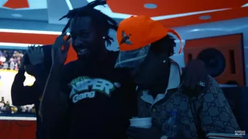 Polo Gucci beige-GG & Orange chiné par Kodak Black en Kodak Black - All Of Us [Official Music Video]