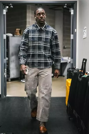 Enfants Riches Déprimés Taupe Paint Splatter Pants worn by Jrue Holiday on the Instagram account @celtics