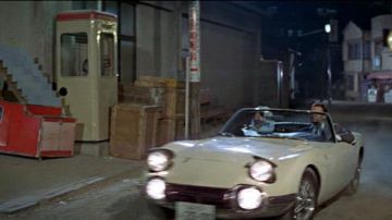 Toyota 2000 GT convertible in white driven by Aki (Akiko Wakabayashi) as seen in You Only Live Twice