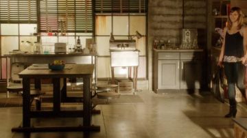 The table with wooden stools seen in Scorpion