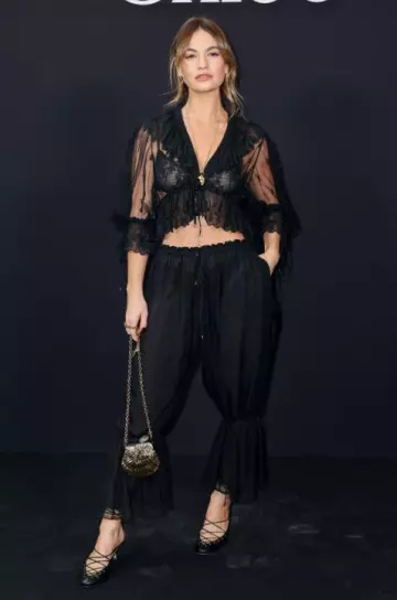 Chloe Ruffled Embroidered Lace Top worn by Lily James at Chloe Show on March 6, 2025