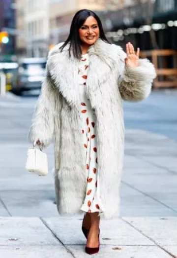St John Faux Fur Coat worn by  Mindy Kaling in New York City on March 6, 2025