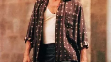 The reddish shirt with white designs worn by Roux (Johnny Depp) in Chocolat