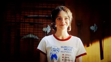 Survival Mode Self Defense Ringer T-Shirt worn by Natalie (Emma Myers) in A Minecraft Movie