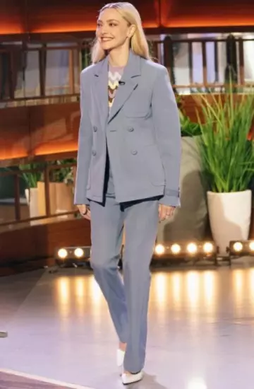 Versace Pressed-Crease Trousers worn by Amanda Seyfried at The Kelly Clarkson Show on March 12, 2025