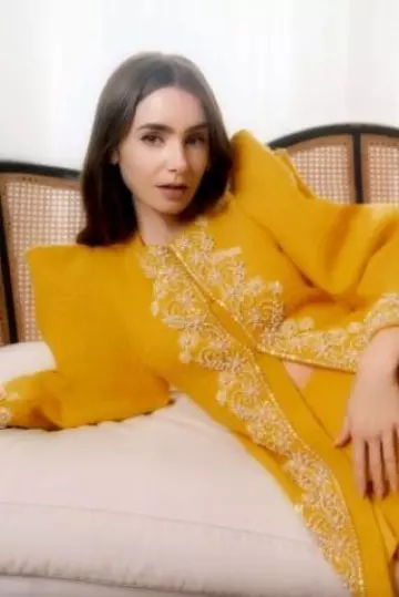 Carolina Herrera Embroidered Virgin-Wool Mini Skirt worn by Lily Collins at  Instyle post on September 2024