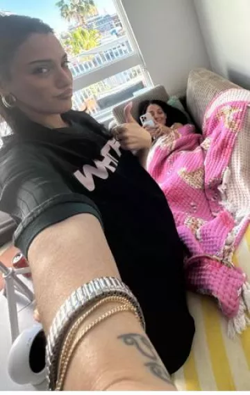 White Fox Let’s Move on Oversized Jersey worn by Niki DeMartino on Her Instagram Story post on April 11, 2025