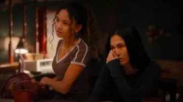 Motel Rocks Izolde Baby Tee worn by Jaz De La Rosa (Faith Bryant) as seen in The Cleaning Lady (S04E04)
