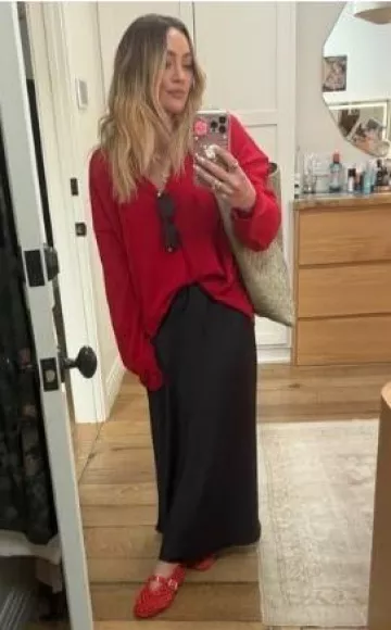 Reformation Layla Silk Skirt worn by Hilary Duff on her Instagram post on April 11, 2025