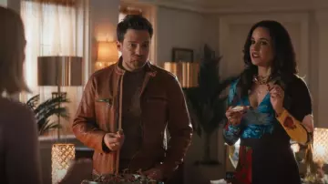 Alice + Olivia Melina Faux Wrap Wide Leg Jumpsuit In Le Parisien Black worn by Birdie (Melissa Fumero) as seen in Grosse Pointe Garden Society (S01E10)