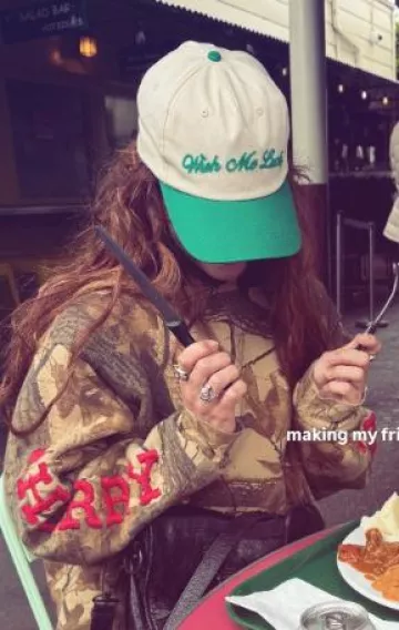 Wish Me Luck Signature Cap worn by Dixie D'Amelio at Gabriela Moura's Instagram Story on April 23, 2025