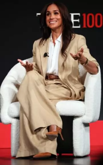 Ralph Lauren Collection Greer Silk-Linen Twill Pleated Pant in Lux Tan worn by Meghan Markle at  Time100 Summit on April 23, 2025
