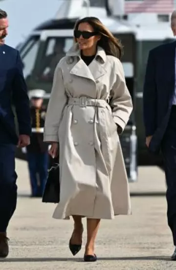 Dolce & Gabbana Double-Breasted Trench worn by Melania Trump in Boarding Air Force One post on April 25, 2025