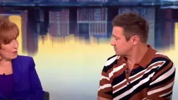 Dolce and Gabbana Diagonal Striped Knit Polo Shirt worn by Jeremy Renner as seen in The View on May 1, 2025