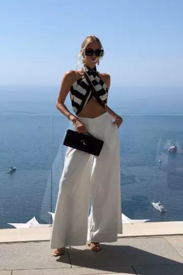 Saint Laurent Cassandre Logo Print Silk Scarf worn by Leonie Hanne on her Blog Post on July 22, 2024