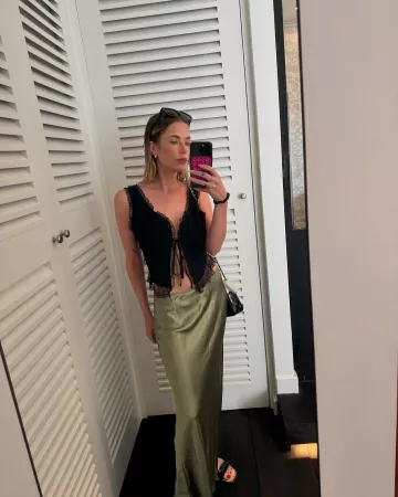 Reformation Layla Bias Cut Silk Maxi Skirt worn by Ashley Benson on her Instagram on July 22, 2024