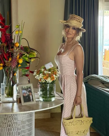 Dior Jardin Raffia Hat worn by Jennifer Lopez on her Instagram on May 11, 2025
