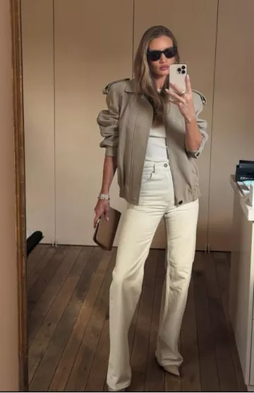 The Row Amazon Beige Shiny Leather Clutch worn by Rosie Huntington-Whiteley on her Instagram Post on May 13, 2025