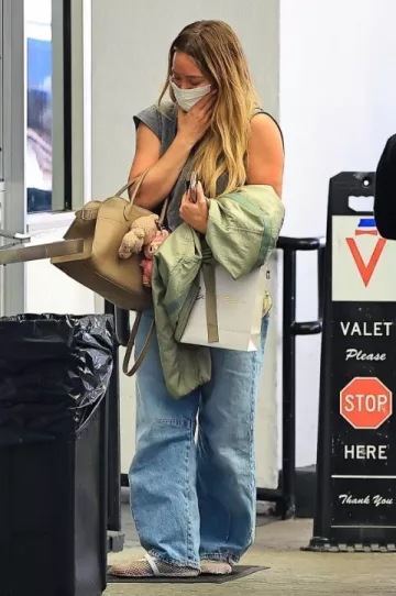 Alaia Patent Leather-Trimmed Mesh Ballet Flats in White worn by Hilary Duff in Beverly Hills on May 9, 2025