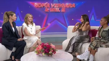 LaQuan Smith Pinstripe Pleated Wide Leg Trousers worn by Erin Andrews as seen in Today with Jenna & Friends on May 14, 2025