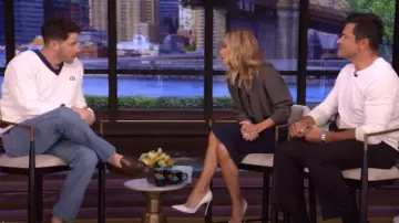 Saint Laurent Lavalliere Neck Blouse in Dotted Silk Satin worn by Kelly Ripa as seen in LIVE with Kelly and Mark on May 15, 2025
