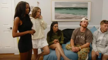 Peppermayo Black Knit Mini Skirt worn by Ciara Miller as seen in Summer House (S09E14)
