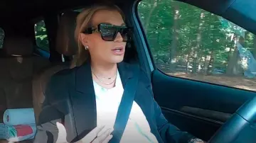 Miu Miu Black Logo-Lettering Sunglasses worn by Lindsay Hubbard as seen in Summer House (S09E14)