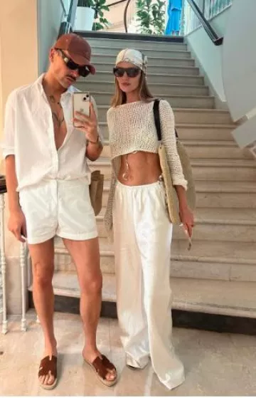 Burberry Knot Check Silk Scarf worn by Rosie Huntington-Whiteley at Hotel Du Cap Eden Roc on May 18, 2025