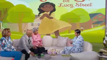 Victoria Beckham Pleat Detail & Flowers Trompe l'Oeil Silk Satin Pants worn by Tamron Hall as seen in Tamron Hall Show on May 16, 2025