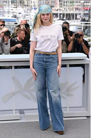 Gucci Printed Silk Carre in Light Blue worn by Elle Fanning at Sentimental Value Photocall at Cannes Film Festival on May 22, 2025