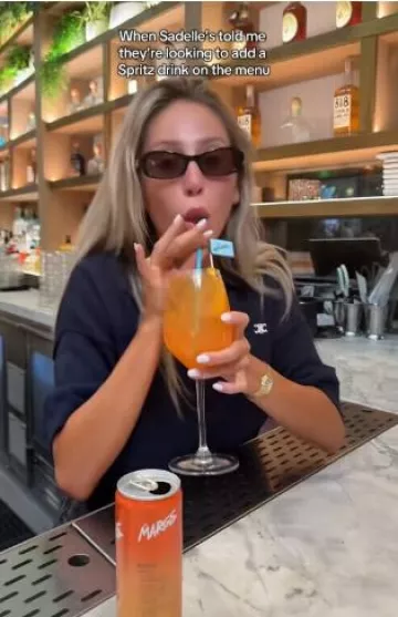 Sip Margs Sparkling Mango Margarita worn by Alix Earle on her Tiktok post on May 31, 2025