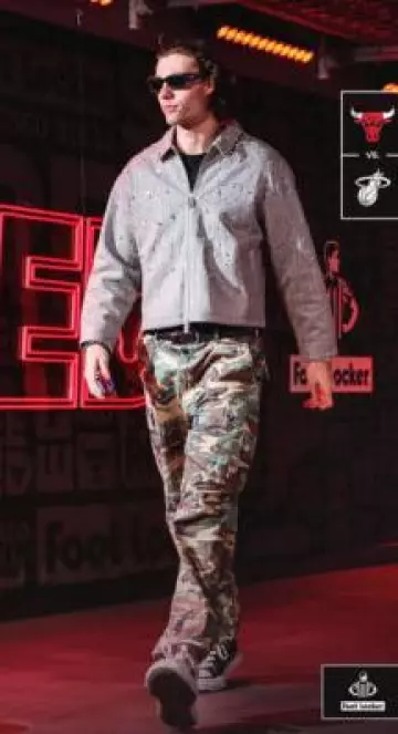 ERL Green Camo Straight Cargo Pants worn by Josh Giddey on the Instagram account @nbafashionfits