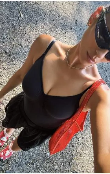 Crocs Hello Kitty Red Classic Clog worn by Shay Mitchell on her Instagram on August 10, 2024