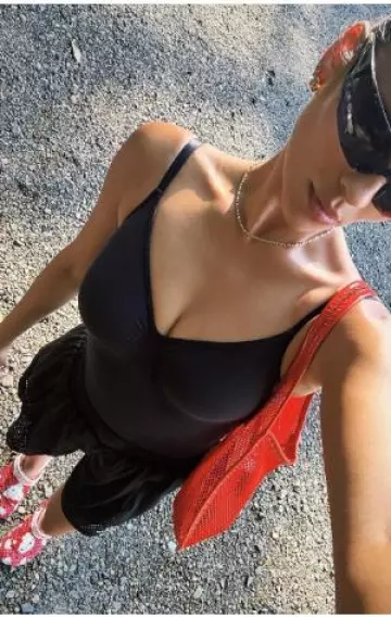 Crocs Hello Kitty Red Classic Clog worn by Shay Mitchell on her Instagram on August 10, 2024