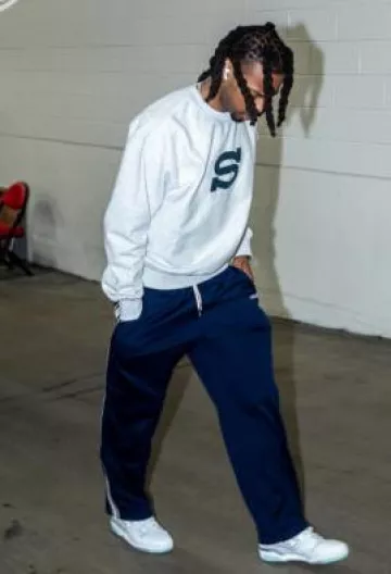 Stussy Light Grey & Navy S Logo Sweatshirt worn by Darius Garland on the Instagram account @nbafashionfits