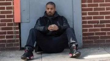 The pair of Nike Air Jordan 6 Retro Infrared sneakers worn by Adonis Johnson (Michael B. Jordan) in the movie Creed: The Legacy of Rocky Balboa