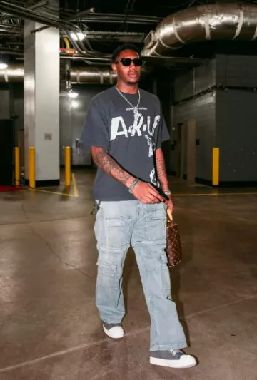 RRR-123 T-Shirt Noir Apocalypse Relief porté par R. J. Barrett sur le compte Instagram @raptors