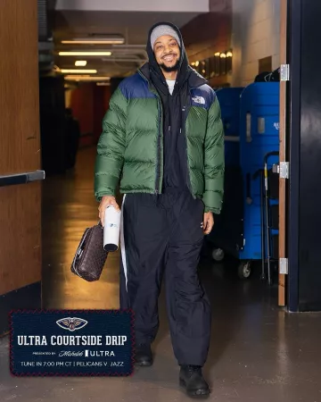 The North Face Dark Green & Navy 1996 Nuptse Down Jacket worn by CJ McCollum on the Instagram account @pelicansnba
