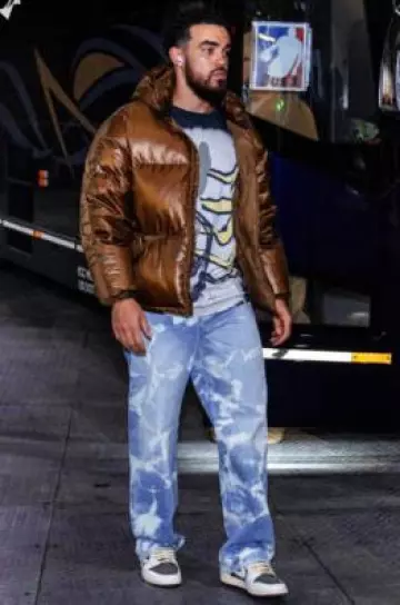 Nahmias Light Blue Bleached Jeans worn by Tre Jones on the Instagram account @suns