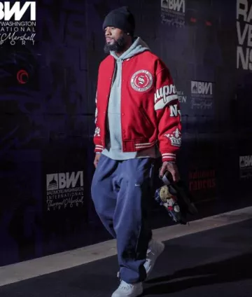 Supreme Red Veritas Varsity Jacket worn by Rashod Bateman on the Instagram account @ravens