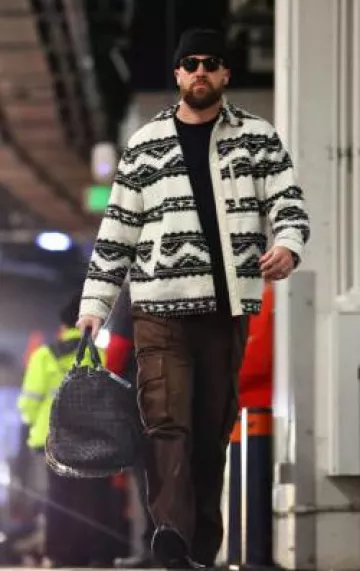 Bottega Veneta Black Intrecciato Leather Large Duffle Bag worn by Travis Kelce on the Instagram account @chiefs