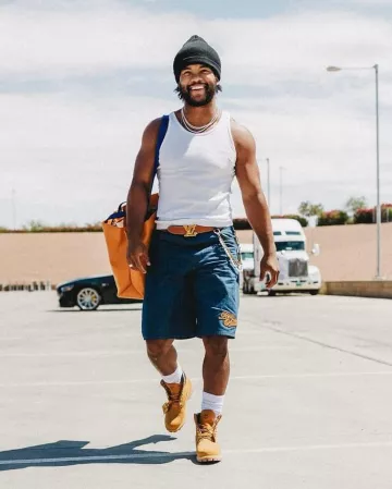 Louis Vuitton Orange Logo Shopper Tote Bag worn by Kyler Murray on the Instagram account @blitzfits