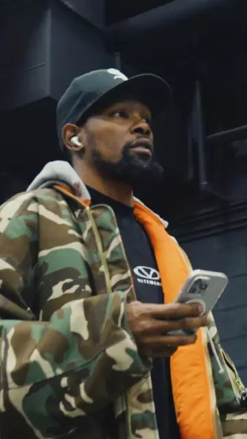 Vetements x Alpha Industries Camo Hooded Bomber Jacket worn by Kevin Durant on the Instagram account @suns