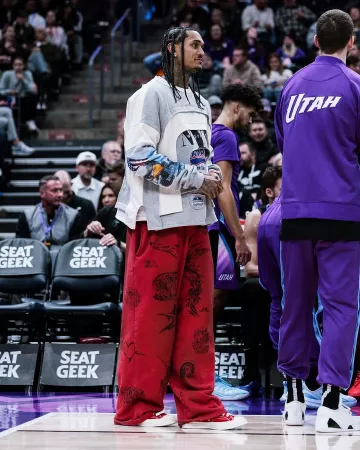 Balenciaga Red Tat-Print Baggy Sweatpants worn by Jordan Clarkson on the Instagram account @leaguefits
